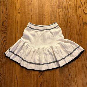 White Pleated Skirt with Black Trim